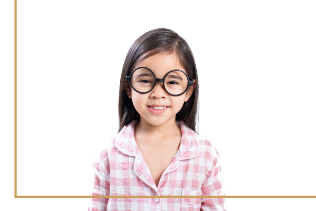 Young girl wearing myopia control glasses with oversized round frames, smiling confidently, promoting children's eye health and vision correction.